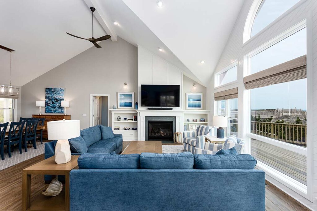 A beautiful bright open concept main space with an ocean view in a Outer Banks, North Carolina beach house remodel.